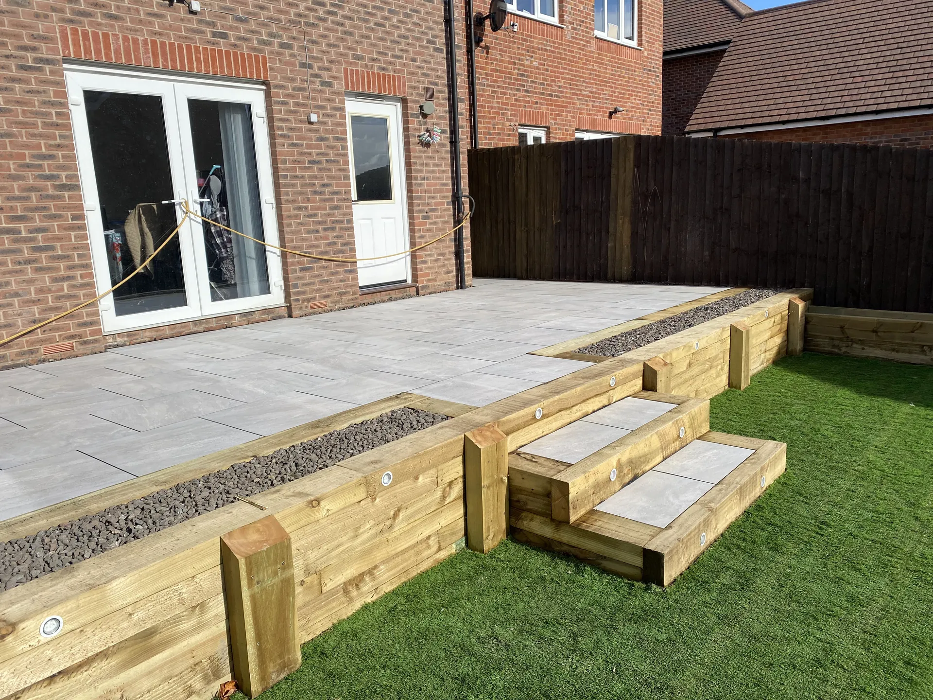 Patio paved with slabs by PaveForce Driveways