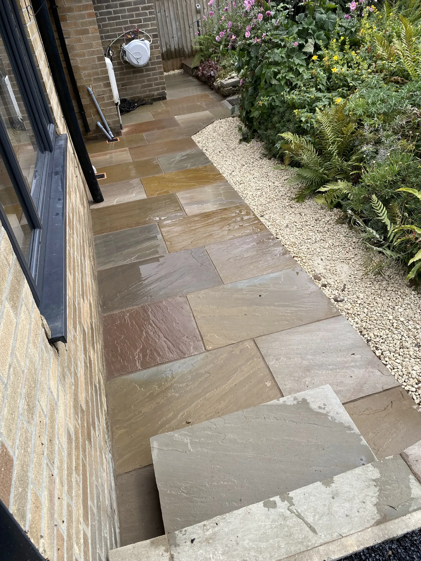 Patio paved with slabs by PaveForce Driveways