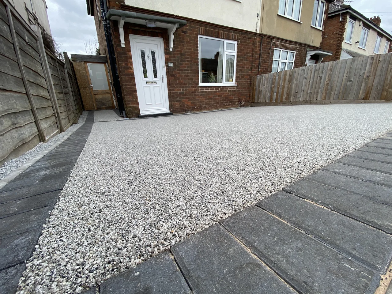 Light aggregate driveway with charcoal edging