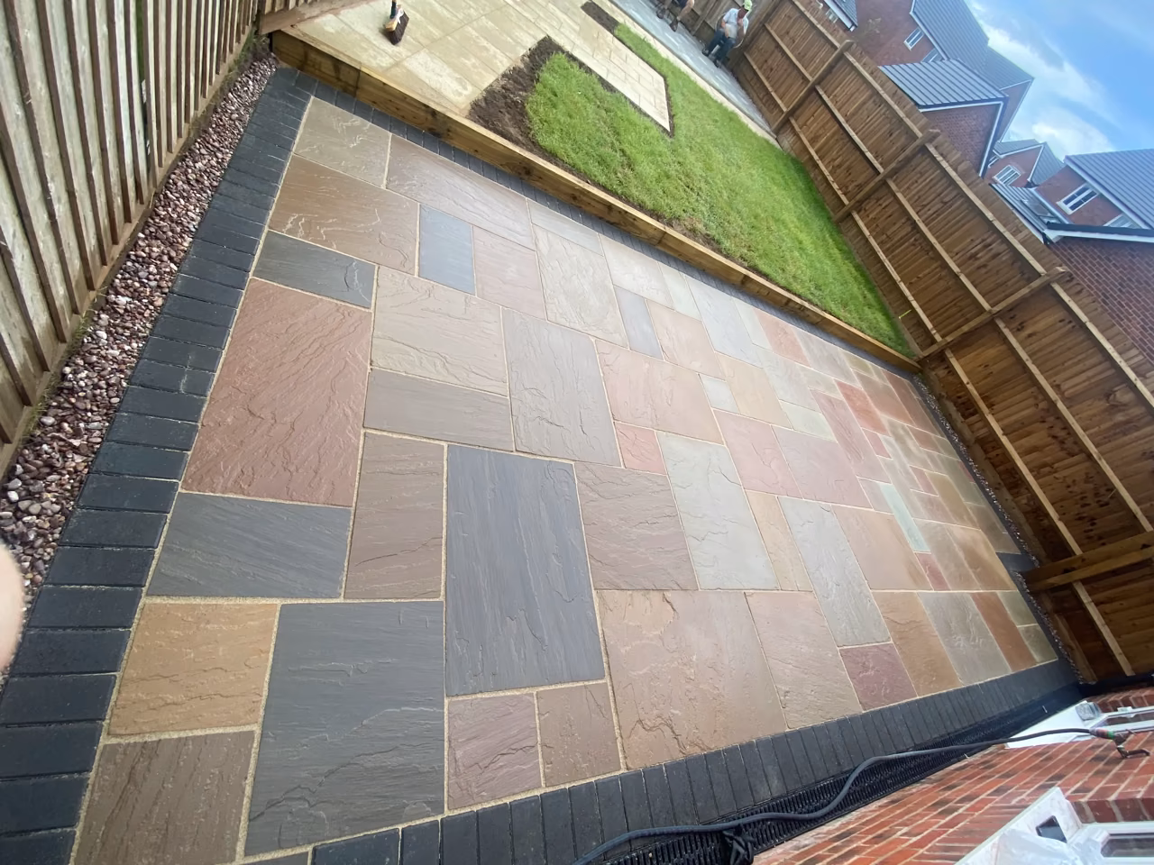 Natural stone garden patio with a contrasting border